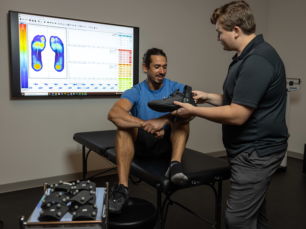 A biomechanics researcher performing ergonomic testing.