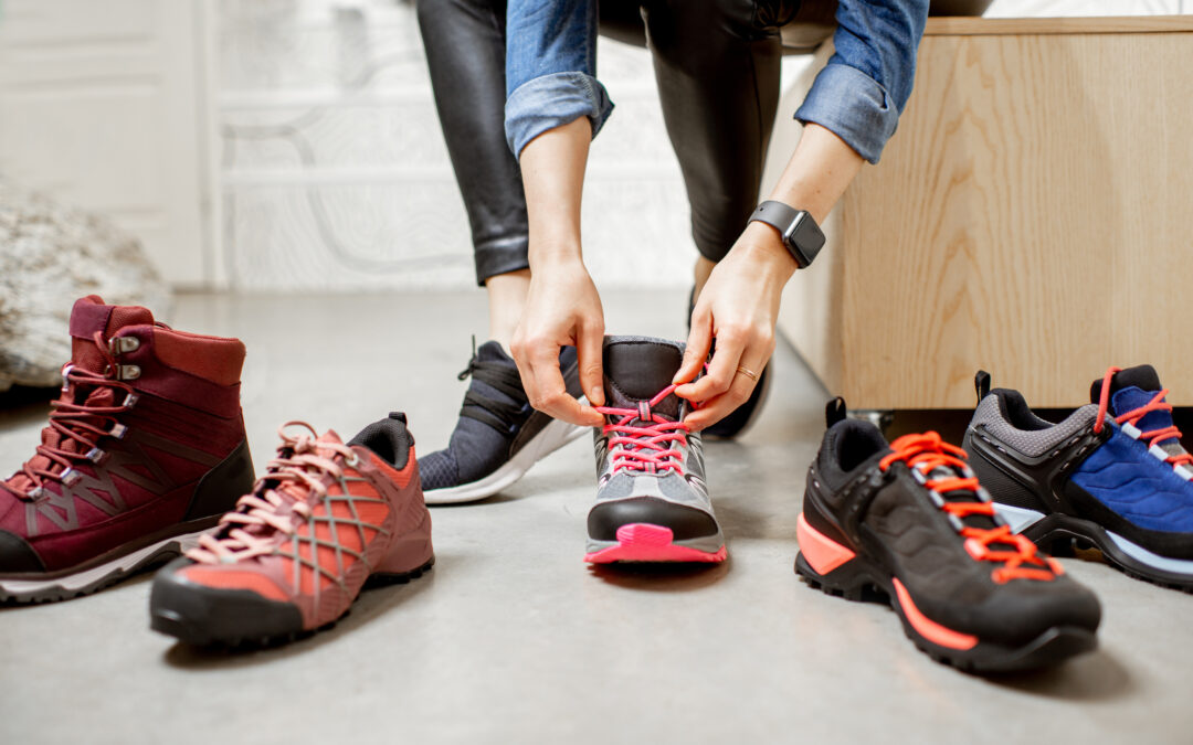 A person trying on an array of athletic shoes with comfortable insoles.