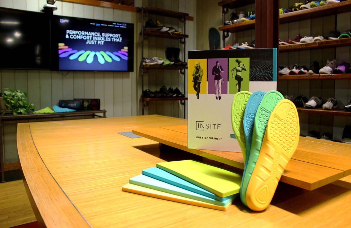 INSITE-display INSITE insoles and marketing material on a table