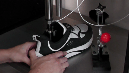 The INSITE material impact tester delivering impact to a sneaker to test shock absorption and energy return