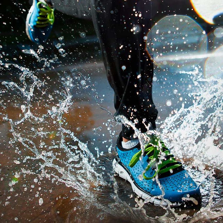 Running Shoe Splashing in Puddle various types of footwear in a pile